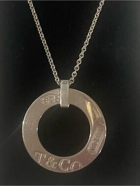 Tiffany &Co. sold sterling silver round pendant